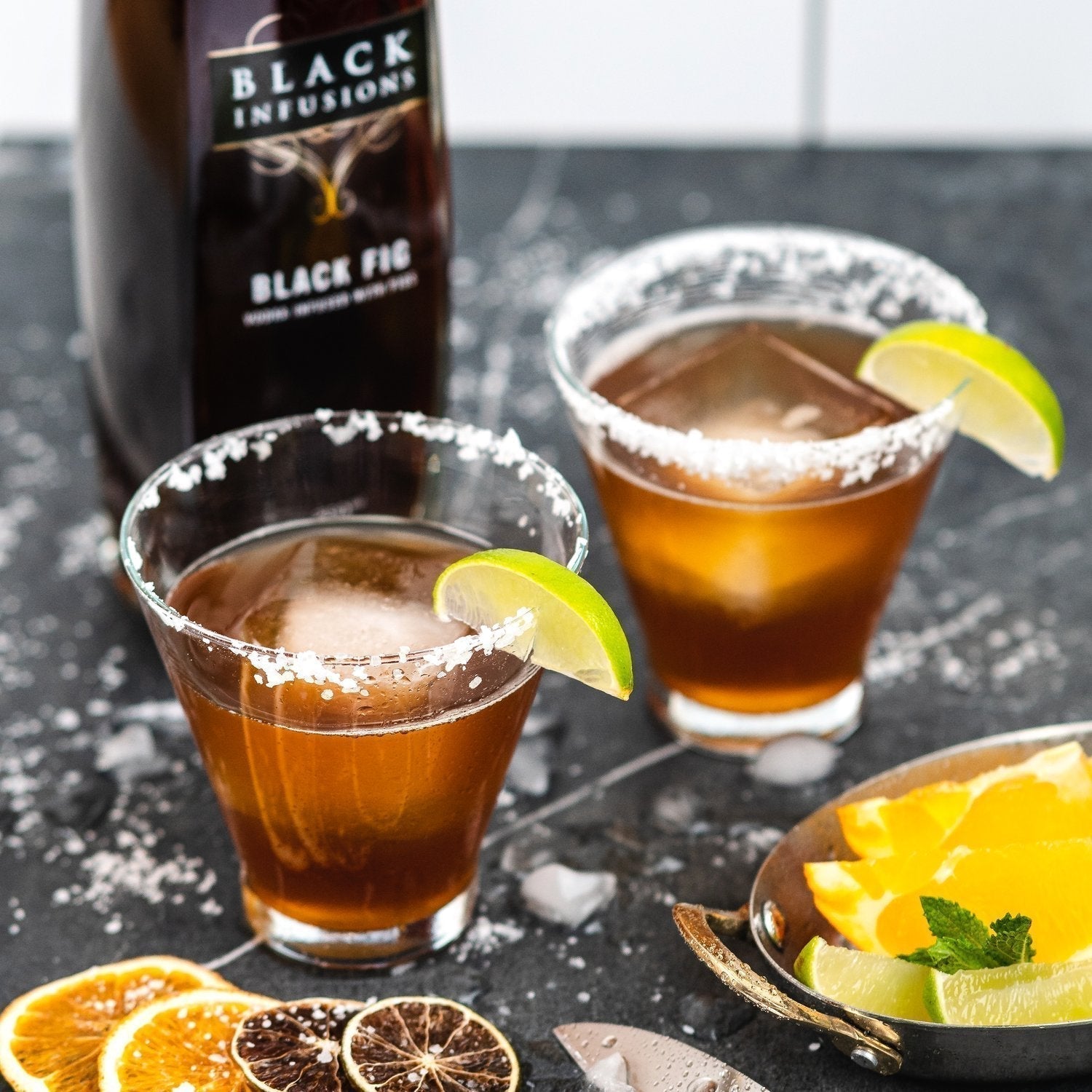 Refreshing skinny fig margarita recipe served in glasses with salt rim and lime garnish